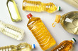 Bottles of oils on light background, top view