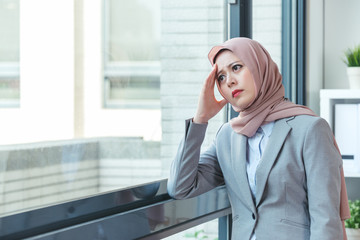 Wall Mural - Muslim lady resting because of annoyed customer