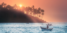 Tropical Beach On Sunset With Fishermen And Sea