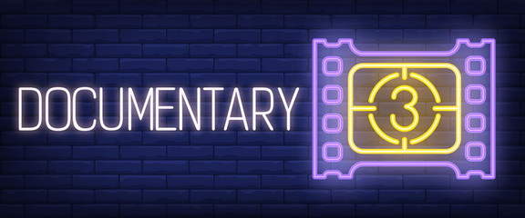 Wall Mural - Documentary neon sign. Film strip and countdown on brick wall background. Vector illustration in neon style for movie watching and cinema