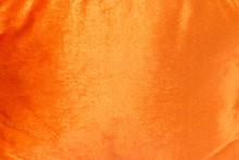 Orange Shiny Velvet Texture Background.