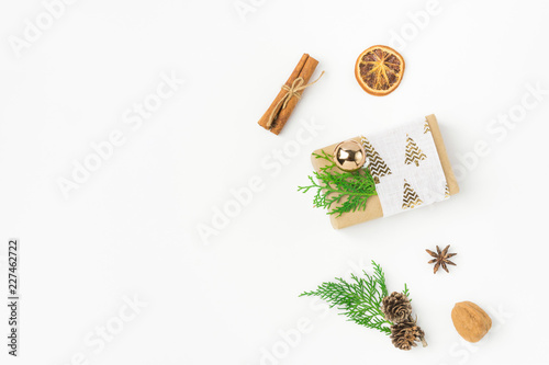 Download Gift Box Wrapped In Craft Paper Tied With Fabric Ribbon Pine Cones Juniper Nuts Cinnamon On Solid White Background New Year Presents Holiday Preparations Diy Minimalist Poster Banner Mockup Buy This PSD Mockup Templates