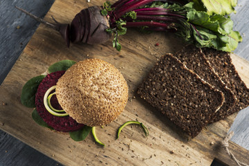 Wall Mural - beet burger sandwich on a table.