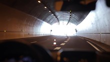 Driving Slowly Through A Tunnel. Light At The End Of The Tunnel
