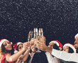 © Prostock-studio - Champagne glasses in people hands at New Year