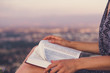 © PhotoGranary - Christian worship and praise. A young woman is reading the bible.