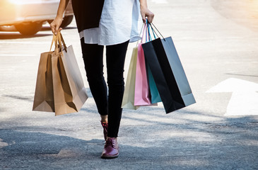 Shopping bags were holding by lady hand,shopaholic lady,