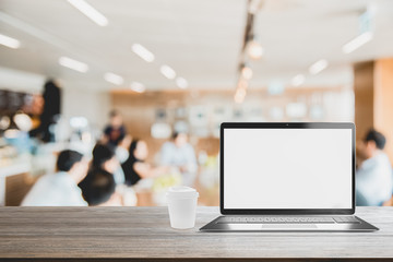 Poster - Laptop with blank screen placed on wooden table Blurred people meeting background ,Startup Business plan and discussing concept background