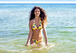 © kravik93 - Beautiful long hair female model wearing bikini, posing in the water, outdoor portrait