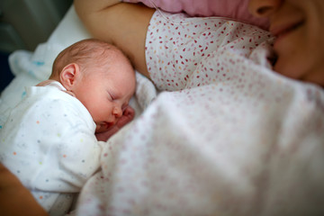 New born baby with his mother