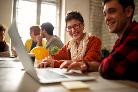 freelance designers in good mood working together.