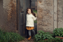 Girl Standing In Doorway