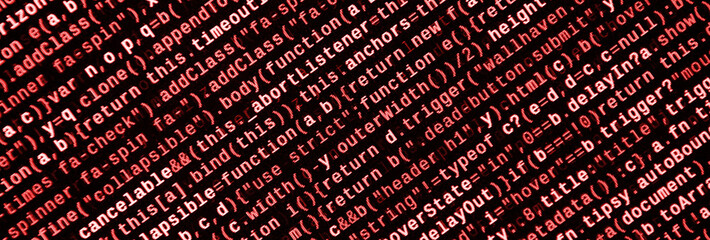 Writing programming code on laptop. Digital binary data on computer screen