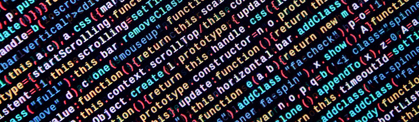 Writing programming code on laptop. Digital binary data on computer screen