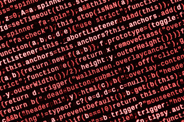 writing programming code on laptop. digital binary data on computer screen