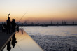 reflection fisherman at sunset