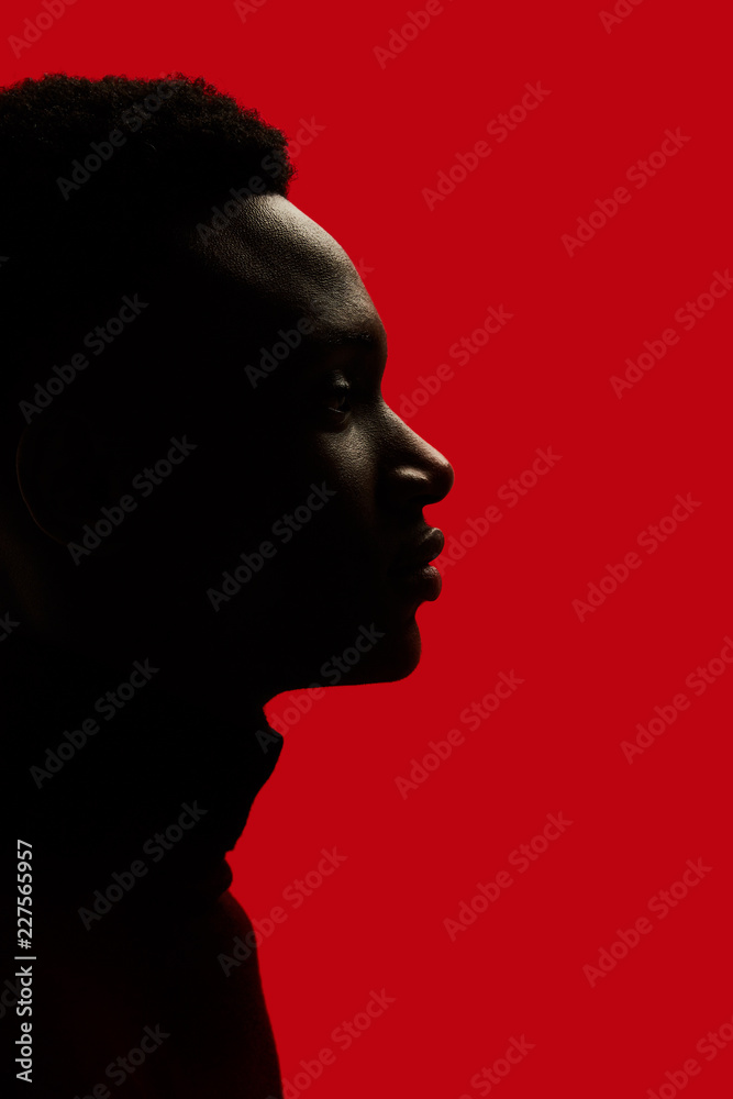African American man portrait profile silhouette isolated over red ...