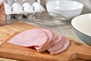 Wall Mural - Sliced ham with raw eggs