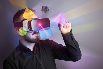 Poster - Amazed businessman with virtual reality colorful geometric shapes in front of him