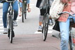 Amsterdam women riding their bikes to work.