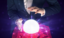 Young Businessman Sitting With Crystal Ball In Action