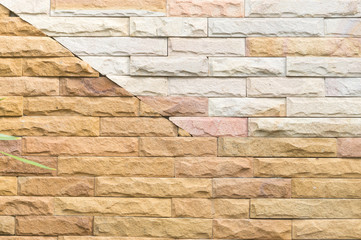 Beautiful dark yellow and white stone wall background in horizontal pattern