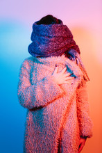 Woman Covered With A Winter Coat And Scarf