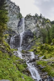 Fototapeta Natura - Waterfall in the forest in Austria near Heiligenblut am Großglockner