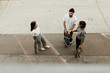 © neekmason/Stocksy - aerial view of three friends with skateboards