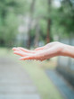 © defun/Stocksy - Asian teenage girl hand in the rain