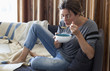 © mentalart/Stocksy - Beautiful woman eating soup.