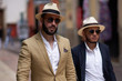 © Pelle/Stocksy - Two stylish men walking in the street