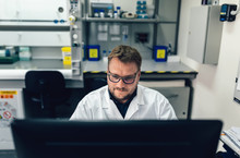 Biologist Working On Computer In The Laboratory Office