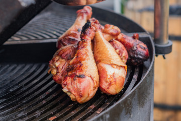 barbeque grilled turkey legs. cooking on open fire