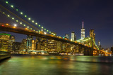 Fototapeta  - Brooklyn Bridge at night with water reflection, New York City Skyline, NY, USA