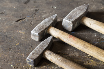 hammers for building and repair. Set of different tools on wooden background