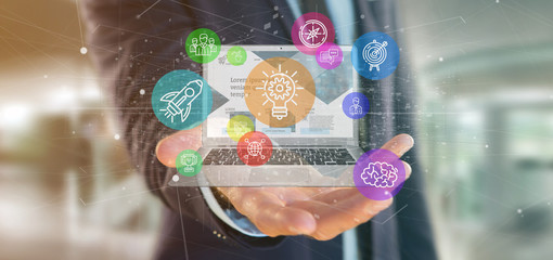 Poster - Businessman holding a Cloud of colorfull start up icon bubble with a laptop 3d rendering