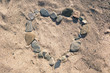Heart shaped stone on sand beach