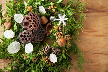 Wall Mural - Christmas wreath on wood desk.