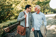 © bnenin - Two elegant men walking in the park.