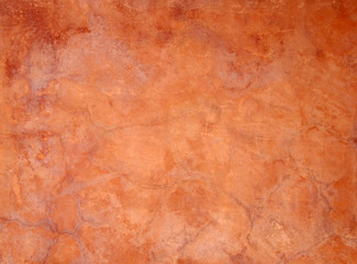 Wall Mural - old orange brown painted faded stained cracked rough plaster wall background