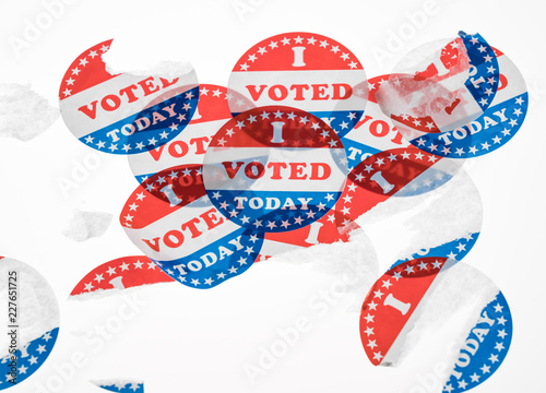 Fotografering Torn and defaced I Voted Today paper stickers on white background
