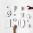 © minorstep - White design items flatlay and hands with different skin colors coming in