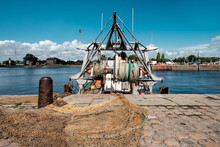 Close-up Of Fishing Nets And Fishing Boat In A Port