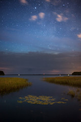 Wall Mural - starry night sky at lake shore