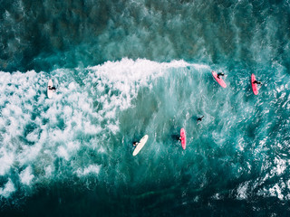 surfer waiting on beach for the next big wave in porto, portugal