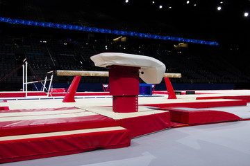 A vaulting horse in a gymnastic arena 