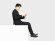 © Tom Wang - side view of business man sitting on blank panel