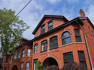 Sticker - row of large old brick houses with gables