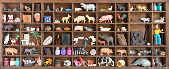 printers oddments tray displaying collection of old toys